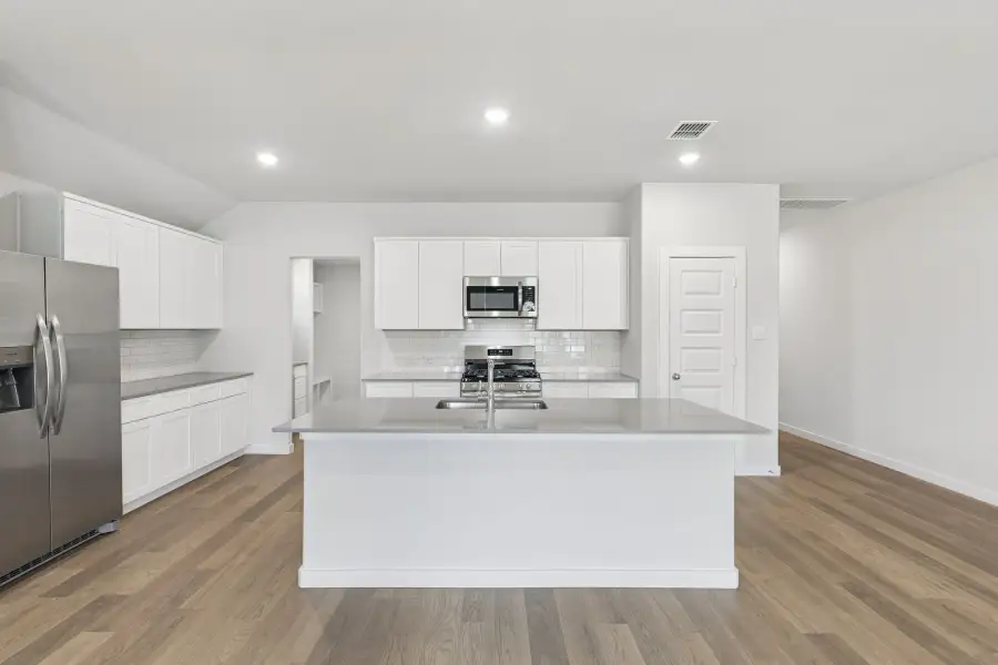 Kitchen in the Harrison home plan by Trophy Signature Homes – REPRESENTATIVE PHOTO Kitchen in the Harrison home plan by Trophy Signature Homes – REPRESENTATIVE PHOTO