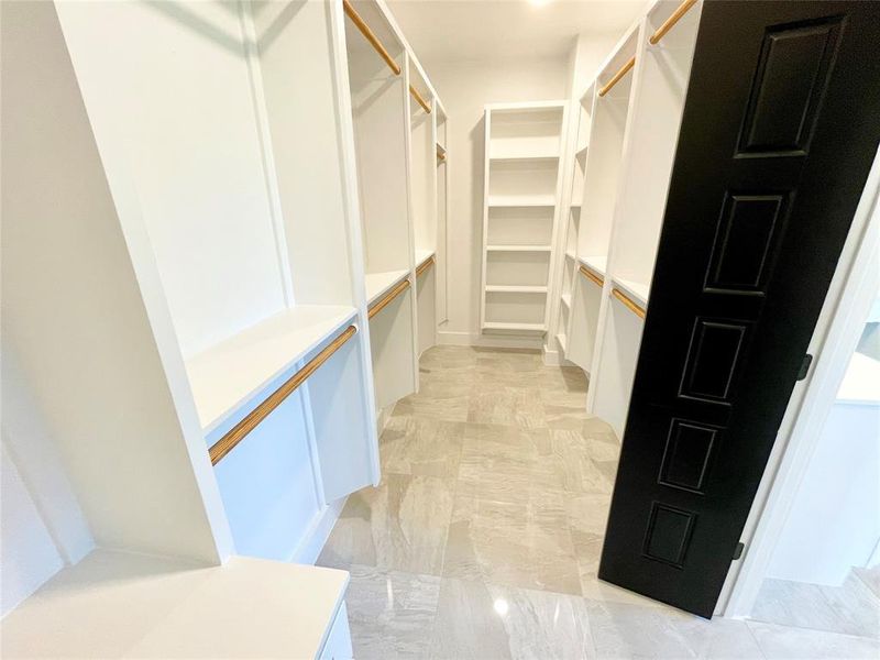 Walk in closet featuring light tile patterned flooring