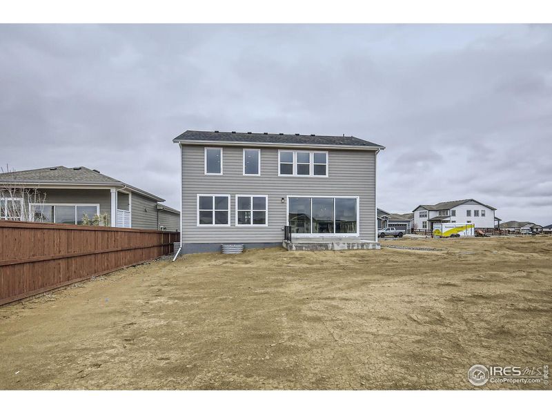 Exterior details and patio area of a home in RainDance, Windsor (Image 27).