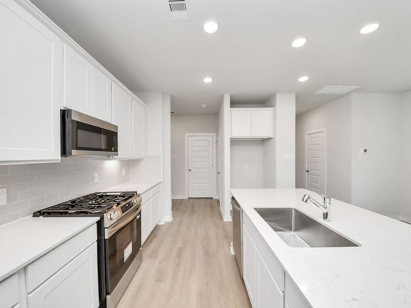 Furnished interior view inside a new home in Caney Creek Place, Conroe (Image 7).