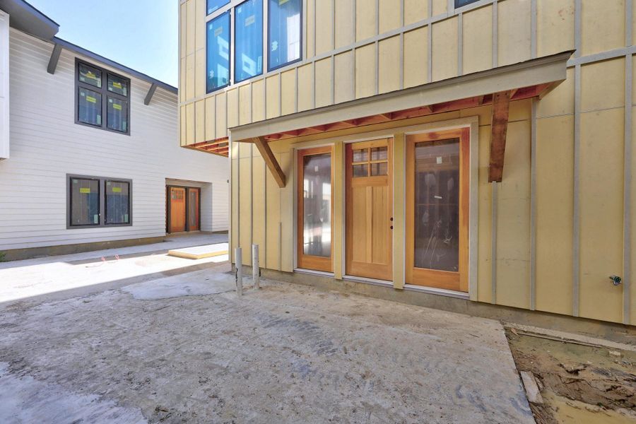 View of exterior entry with board and batten siding