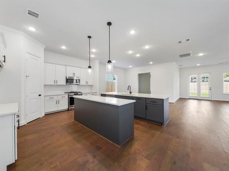 Another view of the dual kitchen islands! (Sample photos of a completed Warwick floor plan. The image may feature alternative selections and/or upgrades.)