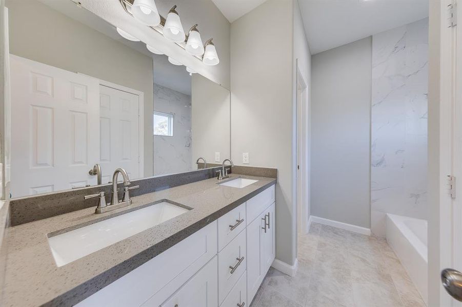 The primary bathroom includesdouble sinks, a walk in closet, and agorgeous shower and tub combo.The toilet is in it's own closet off tothe side to offer privacy.