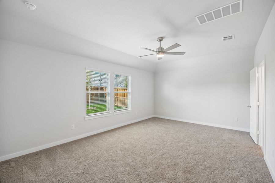 Primary Suite in the Oscar home plan by Trophy Signature Homes – REPRESENTATIVE PHOTO