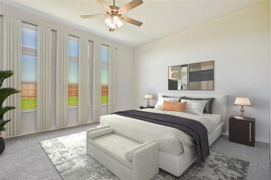 Bedroom featuring ceiling fan and carpet flooring