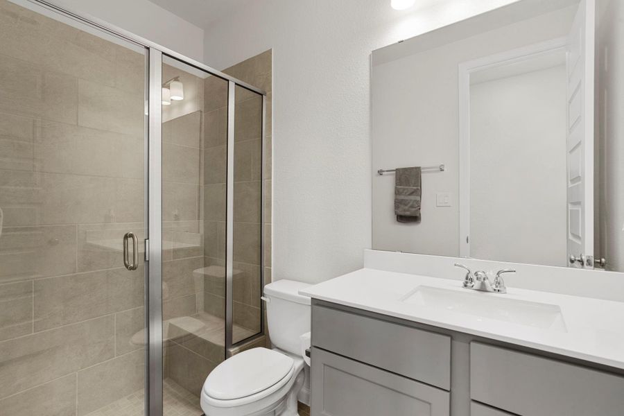 Additional secondary bathroom with a spacious glass-enclosed walk-in shower. Additional secondary bathroom with a spacious glass-enclosed walk-in shower.