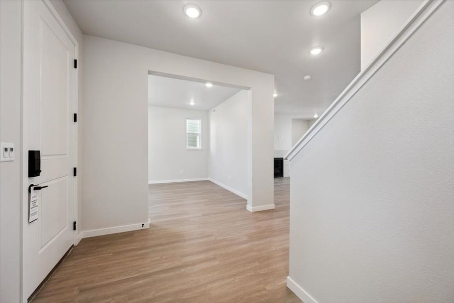 A hallway with white walls. A hallway with white walls.