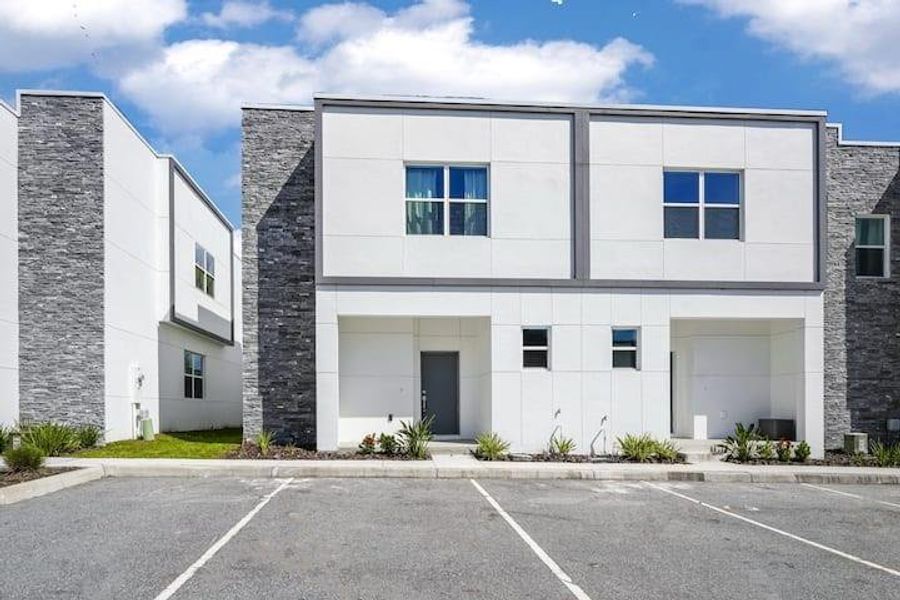 Front exterior of a new home in , Davenport, FL, highlighting curb appeal (Image 2).
