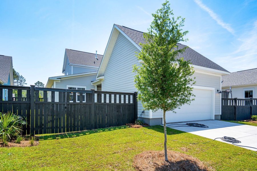 Exterior details and patio area of a home in The Domus Collection at Midtown Nexton, Summerville (Image 27).