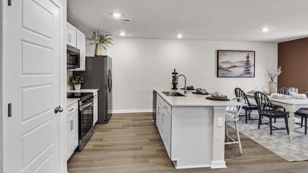 Representative furnished interior of a home built from the Freeport by D.R. Horton in Bailey Park, Fayetteville (Image 16).