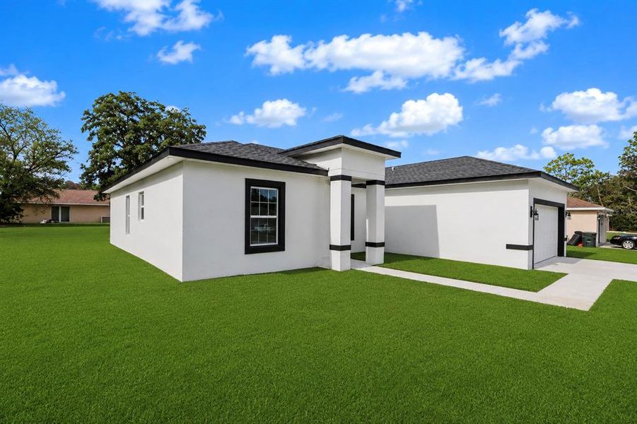 Front exterior of a new home in , Ocala, FL, highlighting curb appeal (Image 27).