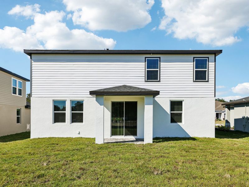 Exterior details and patio area of a home in The Reserve at Hammock Oaks - Signature Series, Lady Lake (Image 2).