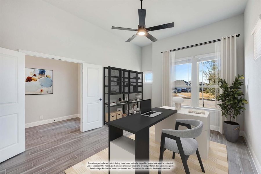 Home office with dark desk, black shelving unit, ceiling fan, and wood-look tile floors Home office with dark desk, black shelving unit, ceiling fan, and wood-look tile floors