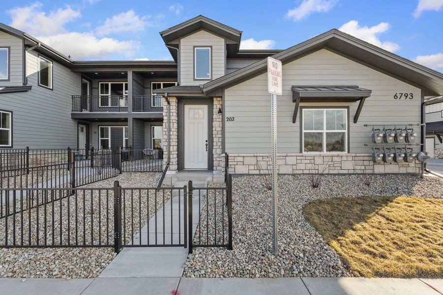 Front exterior of a new home in Wilder at Timnath Ranch, Timnath, CO, highlighting curb appeal (Image 1). Front exterior of a new home in Wilder at Timnath Ranch, Timnath, CO, highlighting curb appeal (Image 1).
