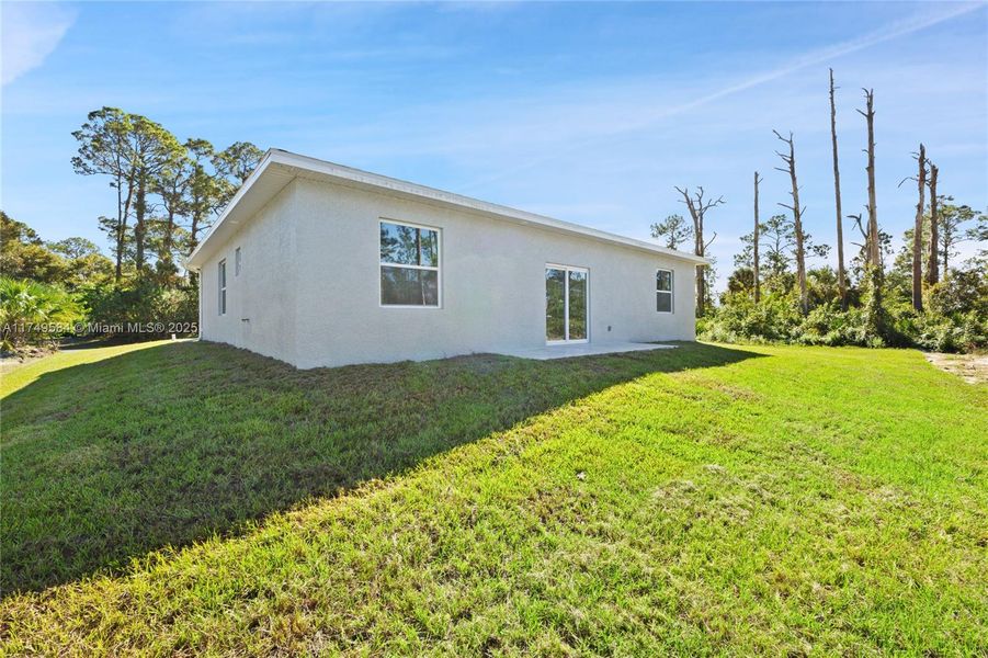 Front exterior of a new home in , Lehigh Acres, FL, highlighting curb appeal (Image 1).