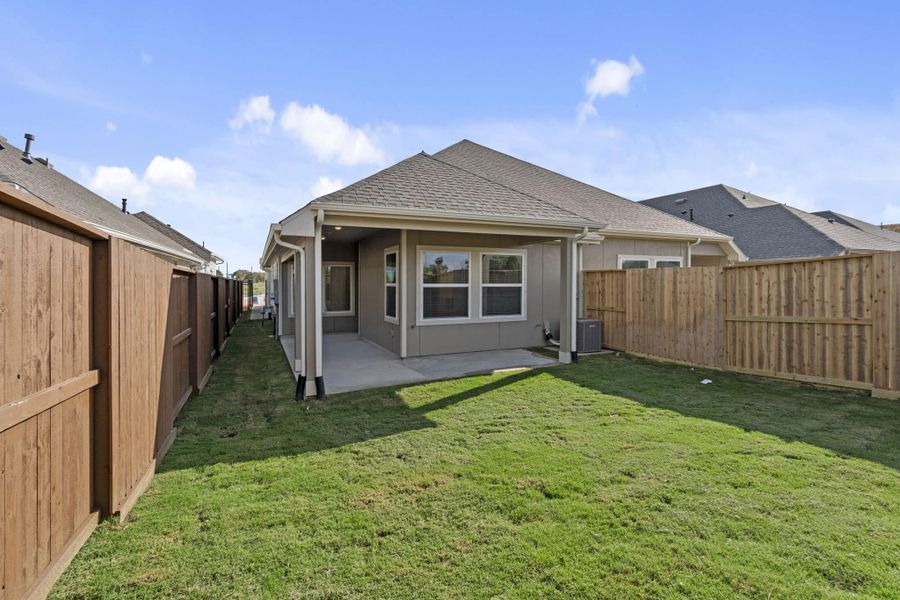 Exterior details and patio area of a home in Meridiana, Manvel (Image 3).