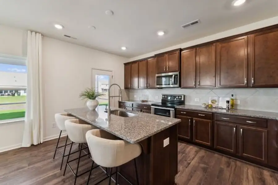 Representative furnished interior of a home built from the Winslow by True Homes in Parc Northwest, Elon (Image 3).