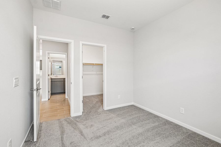 A hallway with white walls.