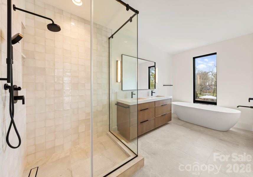 Guest suite with full bathroom and spacious walk-in closet. Guest suite with full bathroom and spacious walk-in closet.