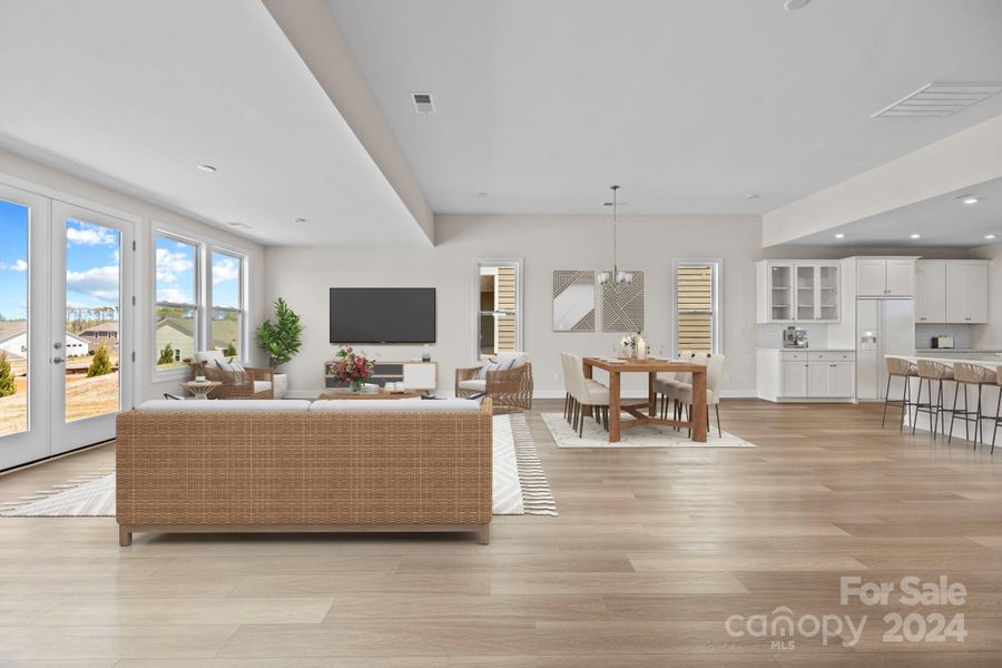 VIRTUALLY STAGED - Low-maintenance EVP flooring, lots of recessed lighting and windows galore make this space  just feel like home.