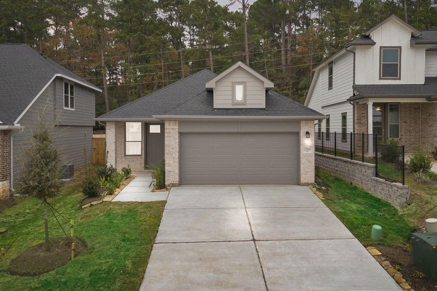 Front exterior of a new home in Westridge Cove, Panorama Village, TX, highlighting curb appeal (Image 18).