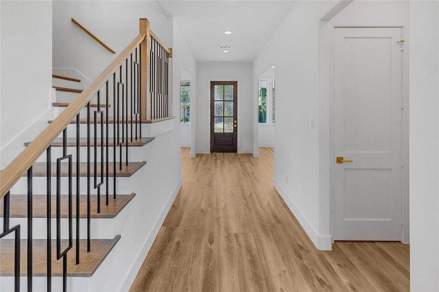 Foyer entrance featuring light hardwood / wood-style floors