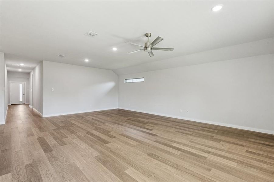 Living and Dining Rooms in the Oscar home plan by Trophy Signature Homes – REPRESENTATIVE PHOTO