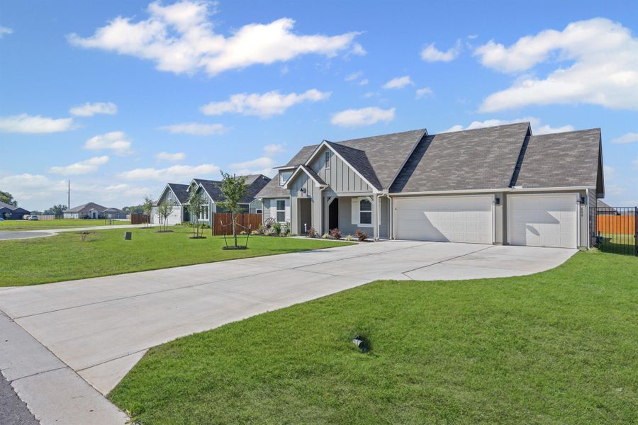 Front exterior of a new home in Hartland Ranch, Lockhart, TX, highlighting curb appeal (Image 19). Front exterior of a new home in Hartland Ranch, Lockhart, TX, highlighting curb appeal (Image 19).
