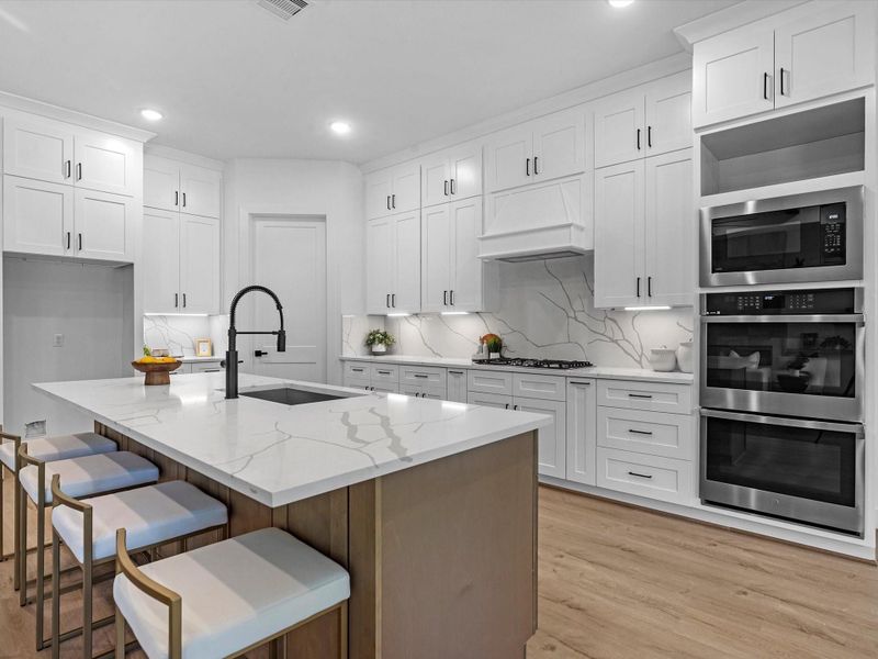 Built-in appliances, including double oven and gas cooktop