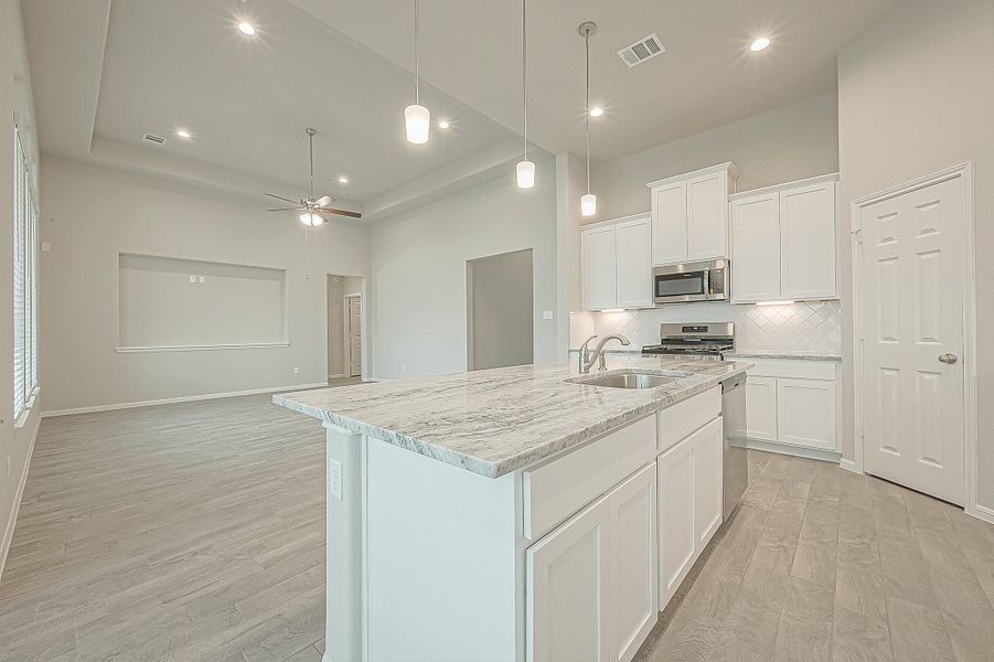 Representative furnished interior of a home built from the Floor Plan 2050 by Colina Homes in Grand Magnolia, Magnolia (Image 30).