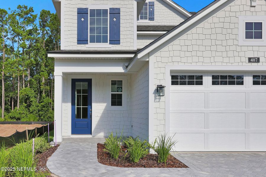 Front exterior of a new home in Reflections at Nocatee, Nocatee, FL, highlighting curb appeal (Image 22).