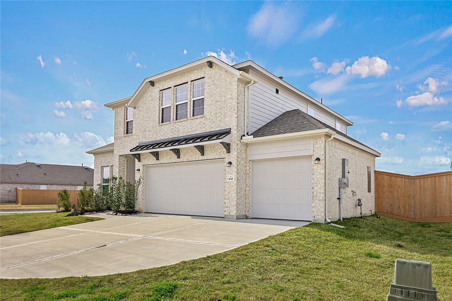 Front exterior of a new home in River Ranch Meadows, Dayton, TX, highlighting curb appeal (Image 2). Front exterior of a new home in River Ranch Meadows, Dayton, TX, highlighting curb appeal (Image 2).