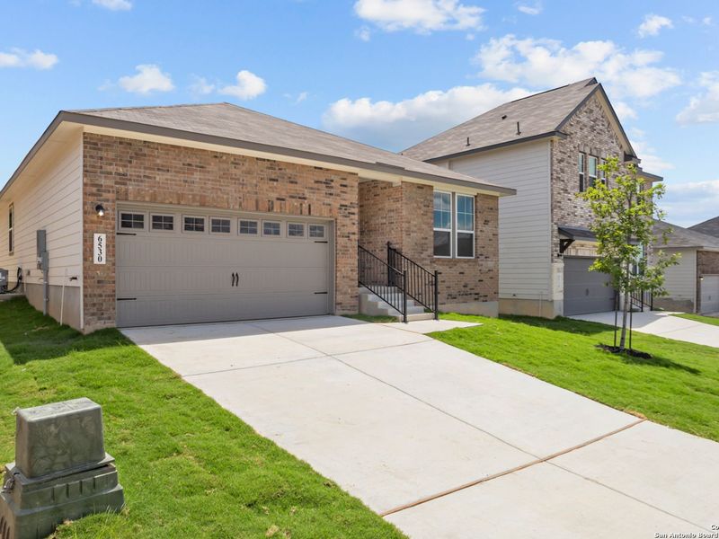 Front exterior of a new home in Royal Crest, San Antonio, TX, highlighting curb appeal (Image 17).