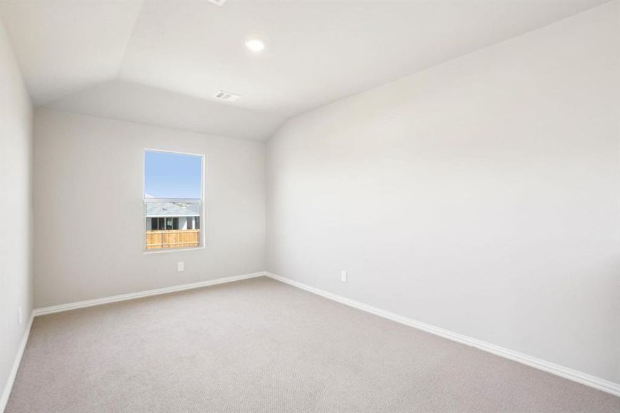 Unfurnished room with carpet, vaulted ceiling, and recessed lighting Unfurnished room with carpet, vaulted ceiling, and recessed lighting