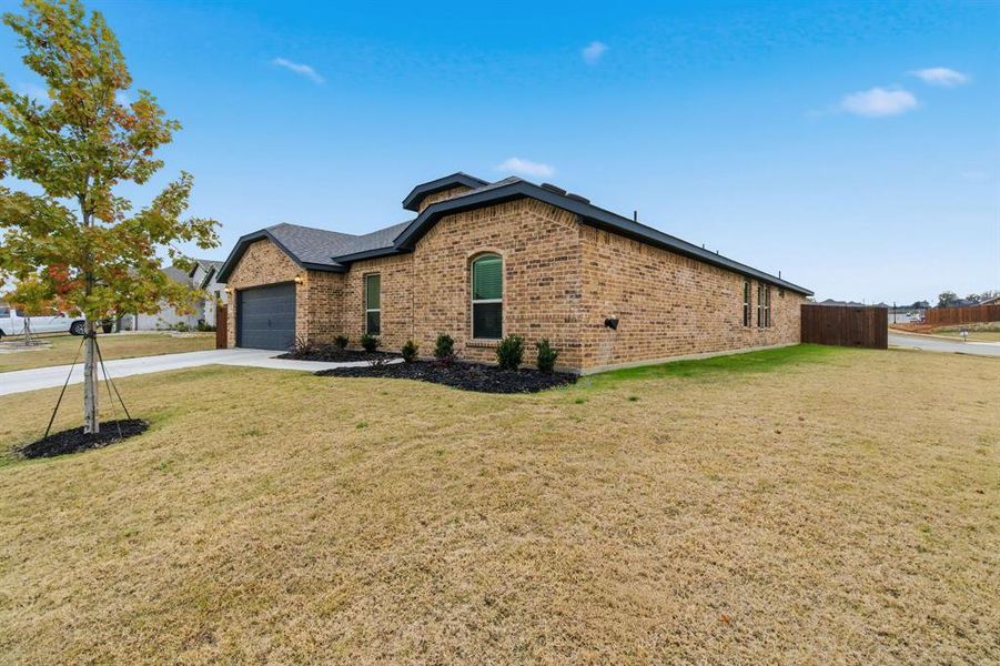 Front exterior of a new home in , Azle, TX, highlighting curb appeal (Image 26).
