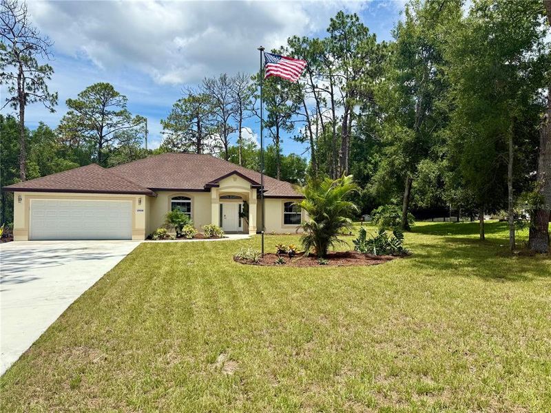 Front exterior of a new home in , Dunnellon, FL, highlighting curb appeal (Image 24).