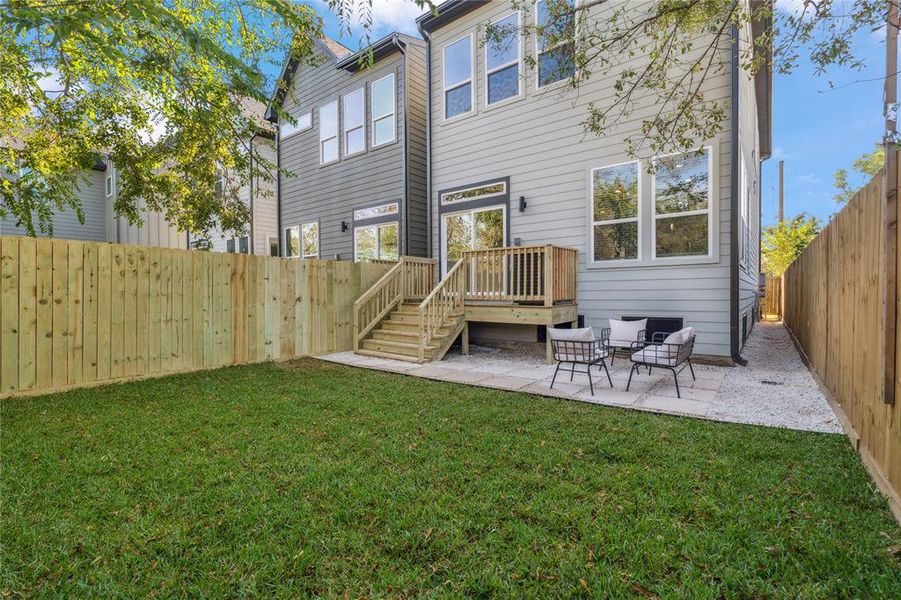 An oversized 2500 sf lot creates a private backyard oasis with patio and a plush outdoor space.