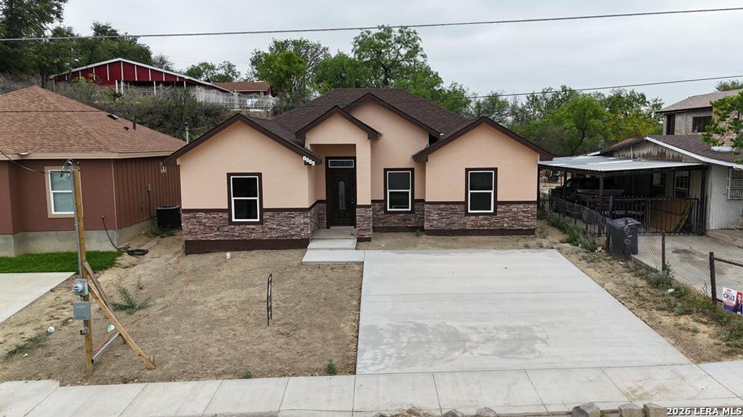 Front exterior of a new home in , Eagle Pass, TX, highlighting curb appeal (Image 20). Front exterior of a new home in , Eagle Pass, TX, highlighting curb appeal (Image 20).