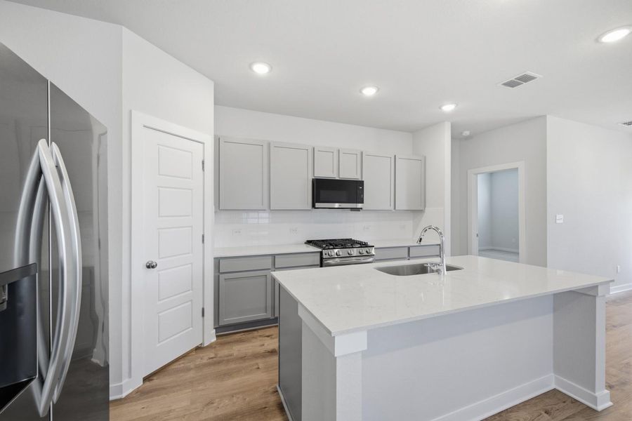 Furnished interior view inside a new home in Stallion Run, Buda (Image 13).