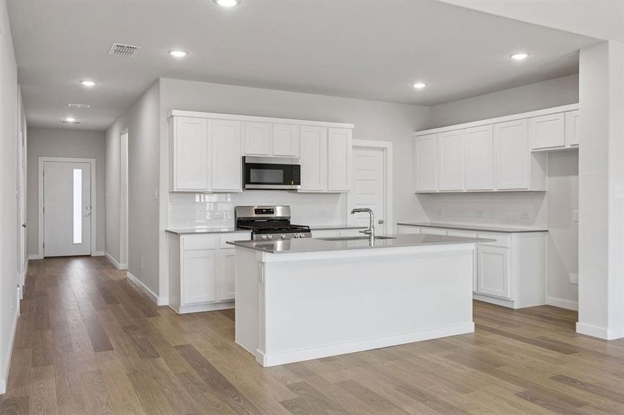 Kitchen in the Masters home plan by Trophy Signature Homes – REPRESENTATIVE PHOTO Kitchen in the Masters home plan by Trophy Signature Homes – REPRESENTATIVE PHOTO