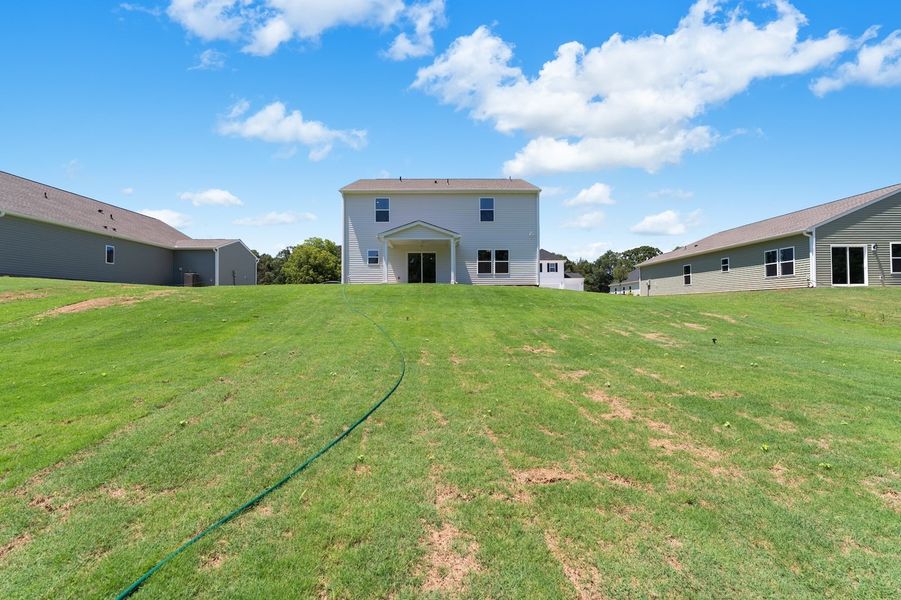 Front exterior of a new home in Burke Estates, Chesnee, SC, highlighting curb appeal (Image 17). Front exterior of a new home in Burke Estates, Chesnee, SC, highlighting curb appeal (Image 17).