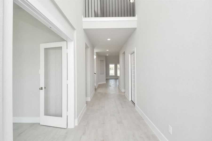 As you step into the threshold of this luxurious home, you'll soon be welcomed by anelegant glass door. Inside, soaring ceilings amplify the spaciousness,while the refined wood-look tile flooring and oversized baseboards exudesophistication and charm.