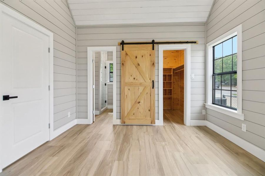 Primary bedroom looking toward walk in closet
