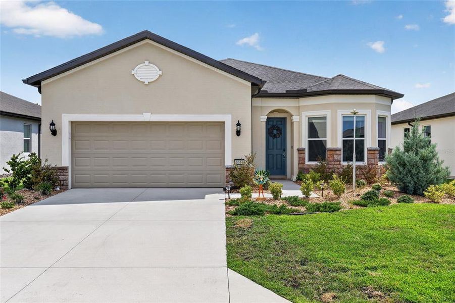 Front exterior of a new home in , Ocala, FL, highlighting curb appeal (Image 25).
