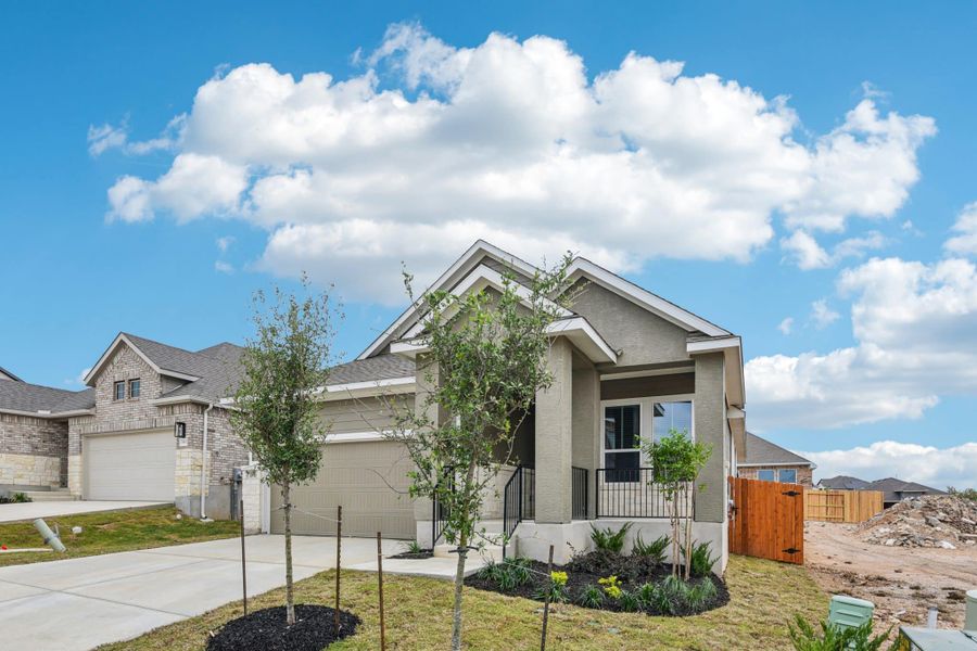 Front exterior of a new home in Meyer Ranch, New Braunfels, TX, highlighting curb appeal (Image 23).