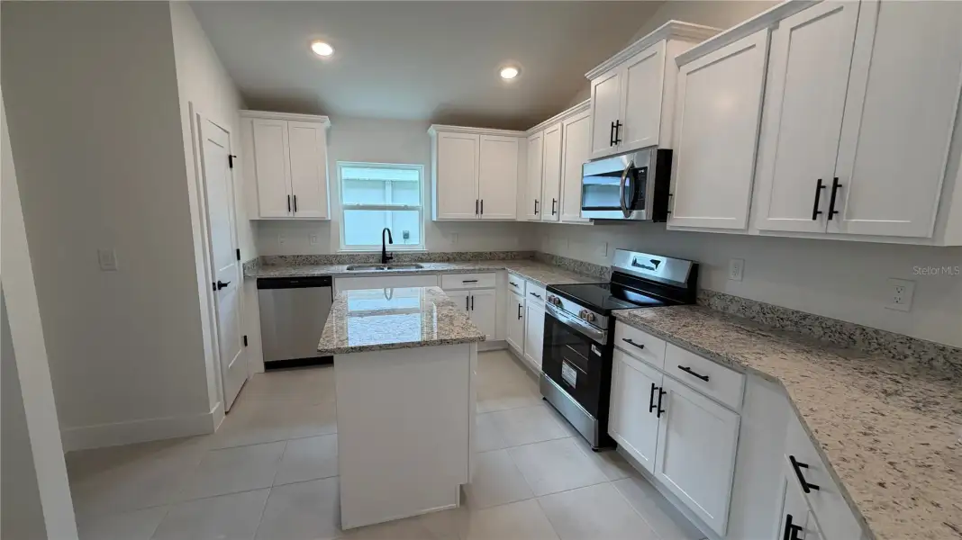 Furnished interior view inside a new home in Watercress Cove, North Port (Image 3).