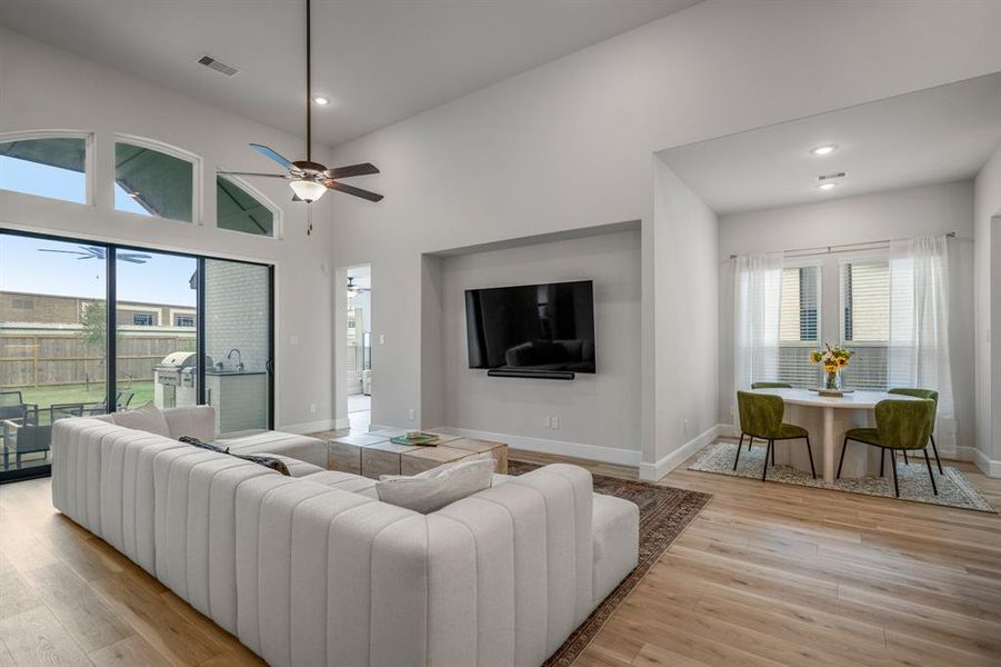 The open concept living room and kitchen makes for a great way to keep the party going and never miss a beat!