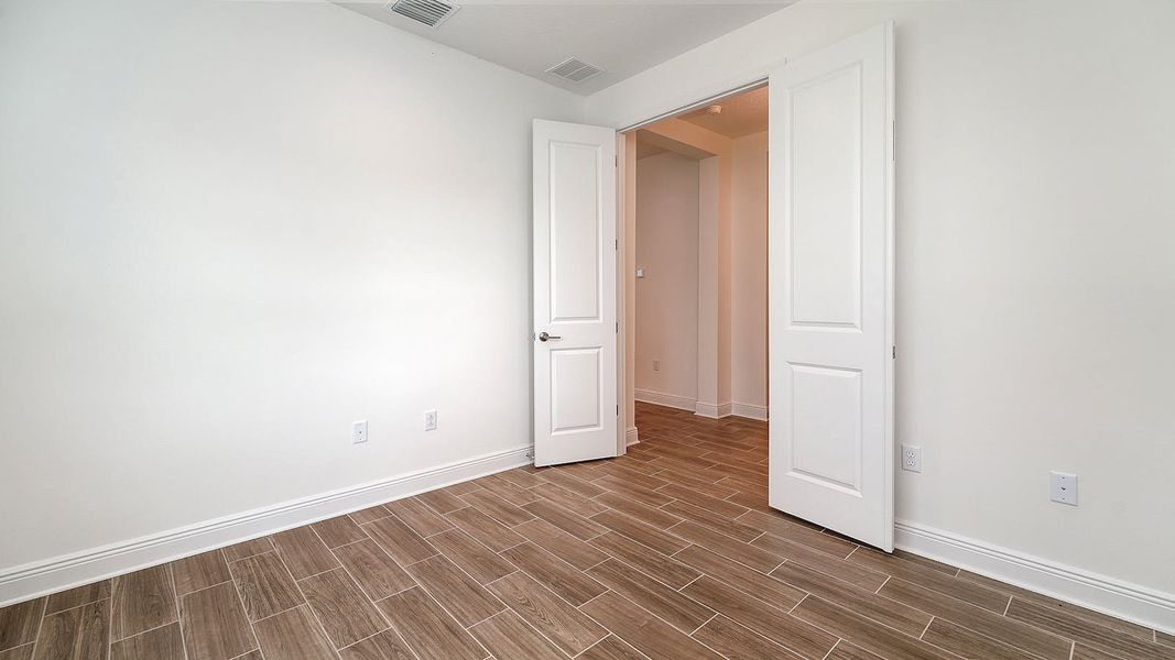 Spacious, unfurnished interior of a new home in Wildleaf Real Estate and Homes for Sale in Parrish, FL - Neal Communities, Parrish (Image 31). Spacious, unfurnished interior of a new home in Wildleaf Real Estate and Homes for Sale in Parrish, FL - Neal Communities, Parrish (Image 31).