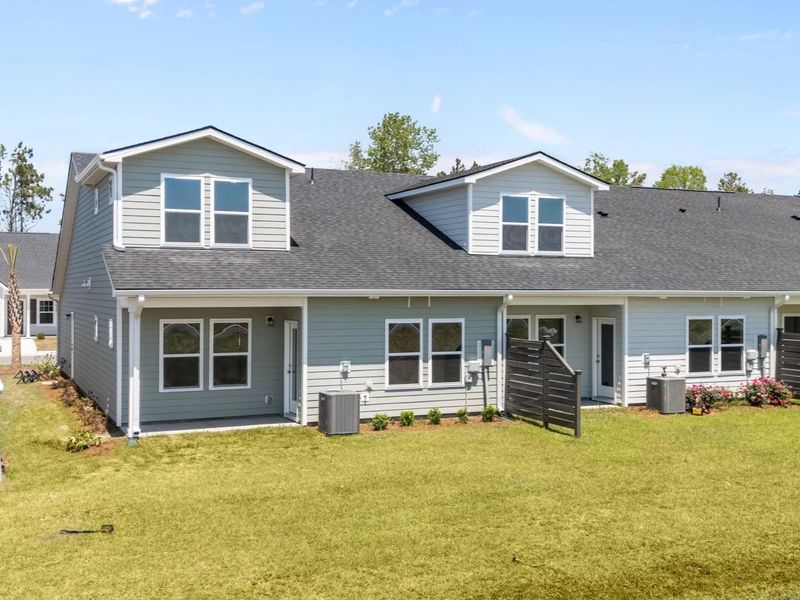 Exterior details and patio area of a home in Blue Heron Retreat, Little River (Image 19).