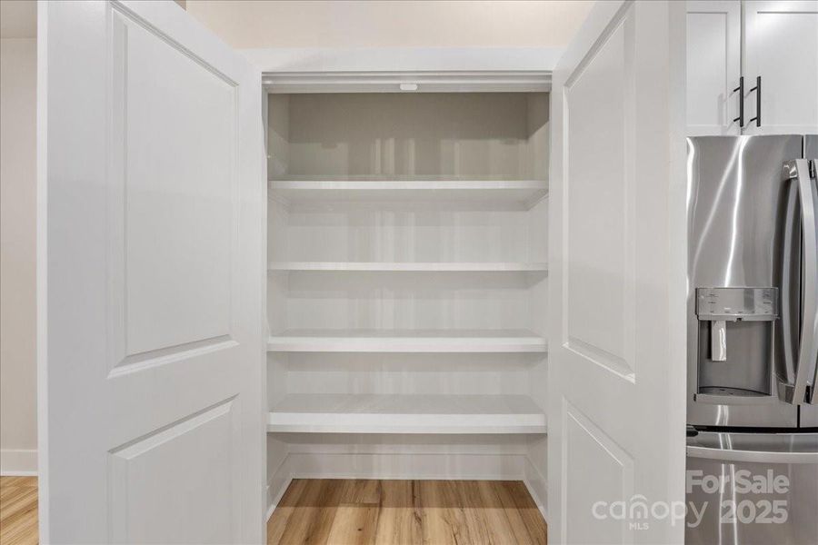Large Pantry with Upgraded Shelving.